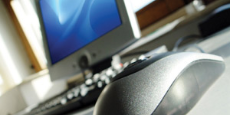 Computer mouse with a desktop in the background