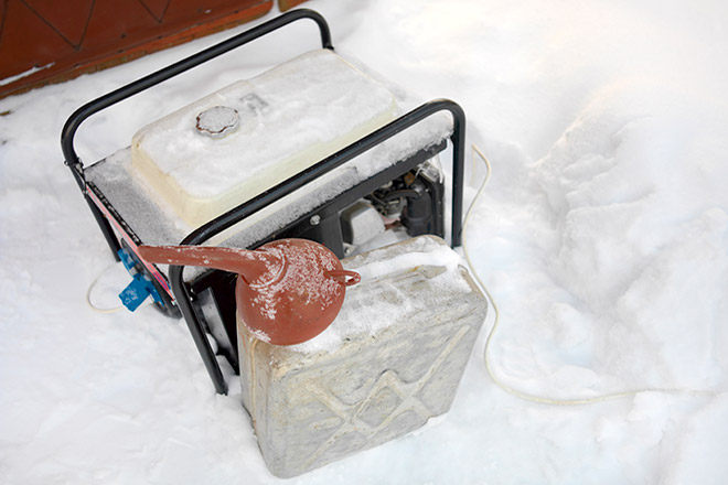 Image of a back-up generator sitting in snow