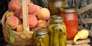 Preserved vegetables and a basket of peaches
