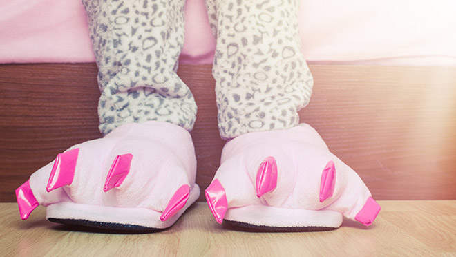 Image of young girl wearing pink animal slippers