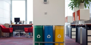 Three recycling bins in an office