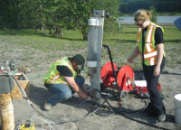 Site C preparation crew working on a pump Site C preparation crew working on a pump