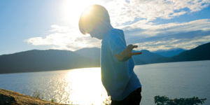 Boy walking and balancing at the beach
