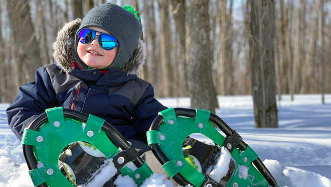 Image of a child wearing snowshoes