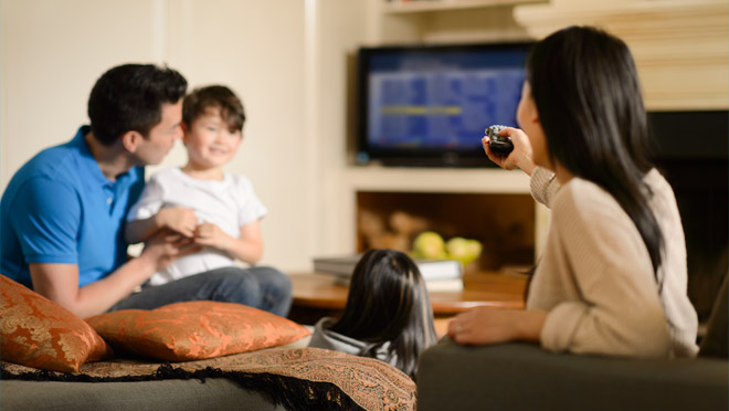 Family watching television together