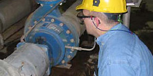 Man inspecting a pump