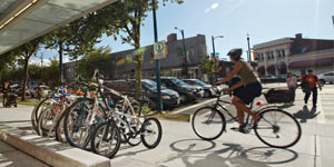 Woman riding a bike through her community