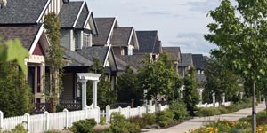 Row of townhouses with a sidewalk