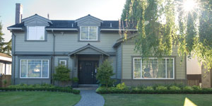 New powersmart home with sky, tree, and lens flare