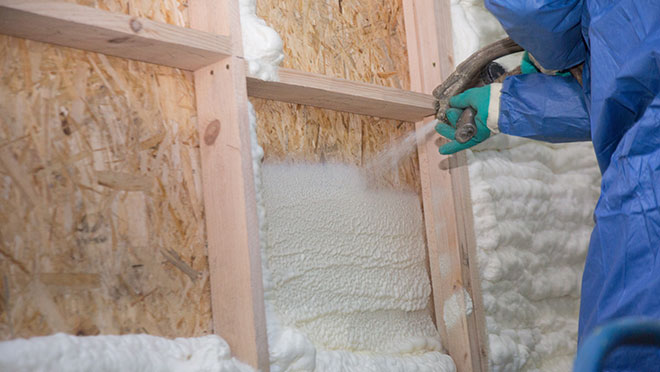 Image of a contractor install blown insulation