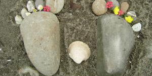 Feet made out of rocks and a shell