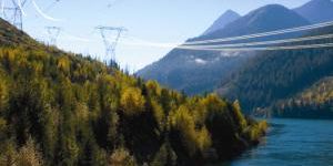 Transmission towers running down the mountain across the water