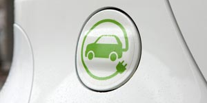 Plug cover for an electric vehicle