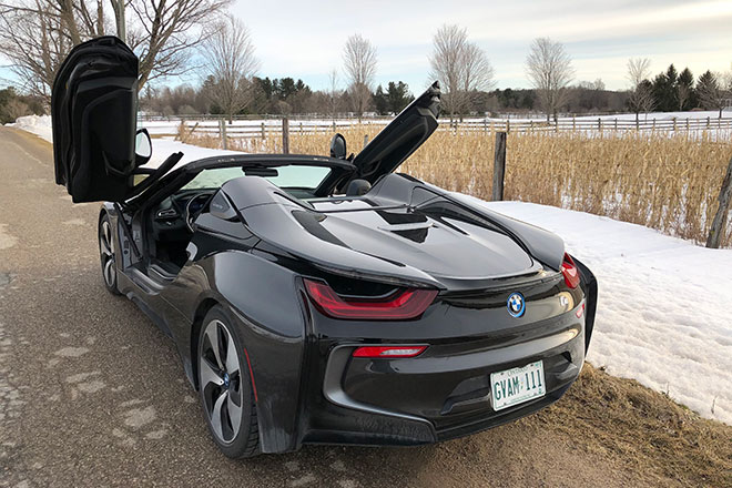 Image of a BMW i8 with the doors open on a Canadian winter day