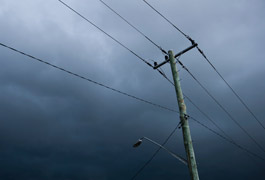 Why are power lines louder in the rain?