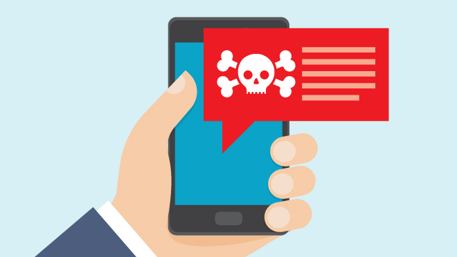 Smartphone illustration with text message scam warning Hand holding smartphone shows text with skull and crossbones warning.