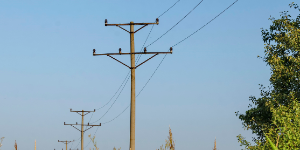 Old metal electric post at summer field, Zavet, Bulgaria