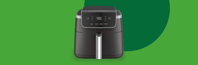 An Air Fryer, over a green background.