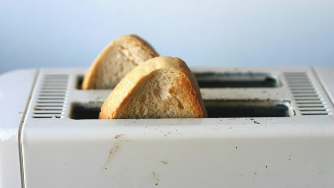Image of fresh toast popping from an old toaster Image of fresh toast popping from an old toaster