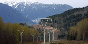 The new Northwest Transmission Line (NTL) 287 kV line is on the right and the existing 138 kV line from Skeena to Stewart is on the left. The view is looking north toward the Skeena River crossing. 