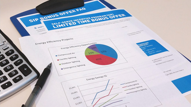 Image of Bonus Offer information with pen and calculator Image of Bonus Offer information with pen and calculator