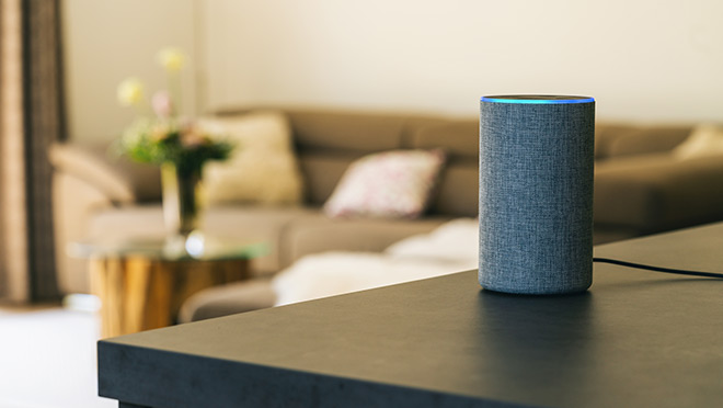 Image of an Amazon Echo smart home device in a home living room Image of an Amazon Echo smart home device in a home living room