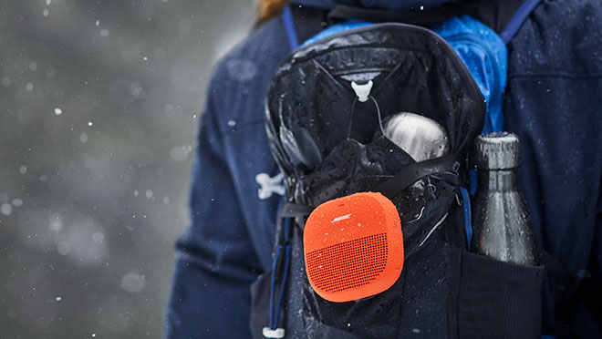Image of Bose SoundLink Micro speaker on a backpack Image of Bose SoundLink Micro speaker on a backpack