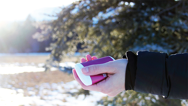 Image of a person holding an EnergyFlux handwarmer Image of a person holding an EnergyFlux handwarmer