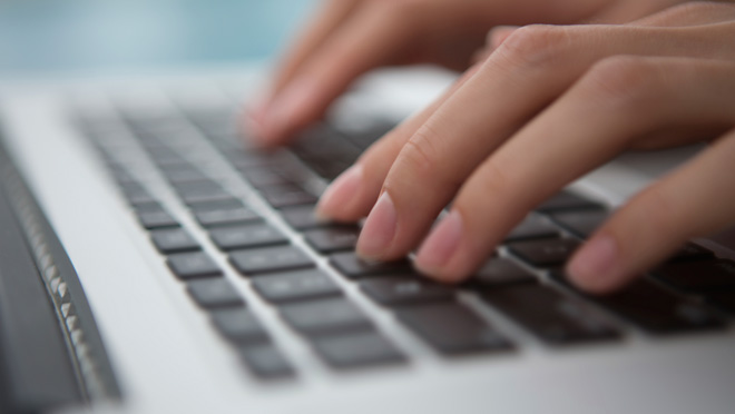 Fingers typing on laptop keyboard Fingers typing on laptop keyboard