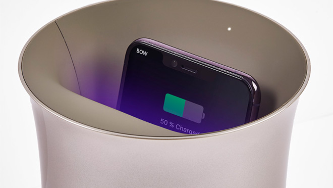 Wireless charging station and sanitizer