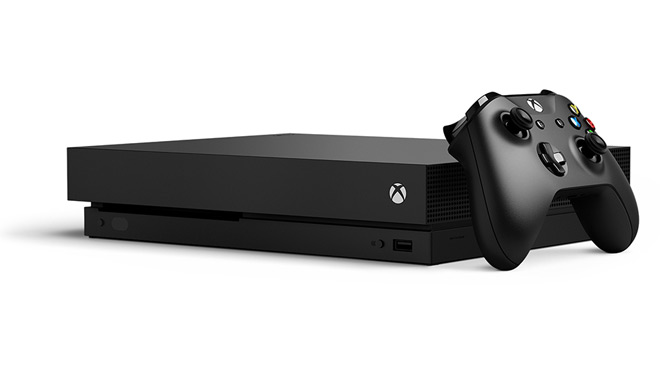 Image of an Xbox One X gaming console and controller Image of an Xbox One X gaming console and controller
