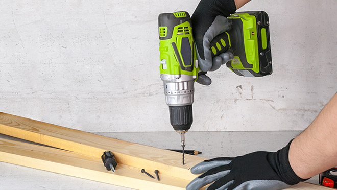 Image of a cordless electric drill in use