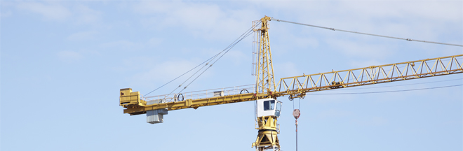 Building cranes on construction site