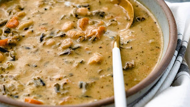 Photograph of a bowl of wild rice soup