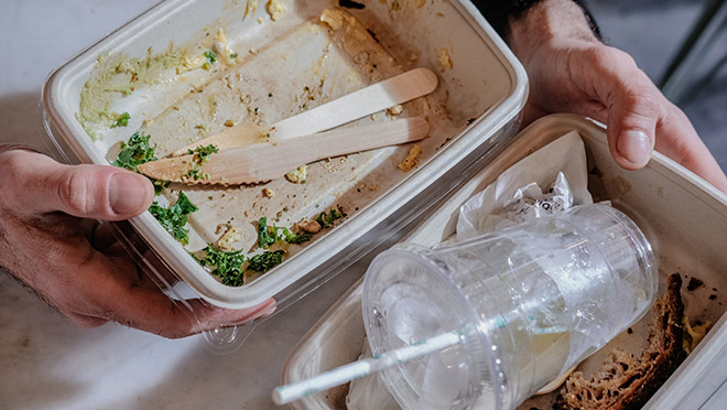 Empty paper food containers to trash after meal 