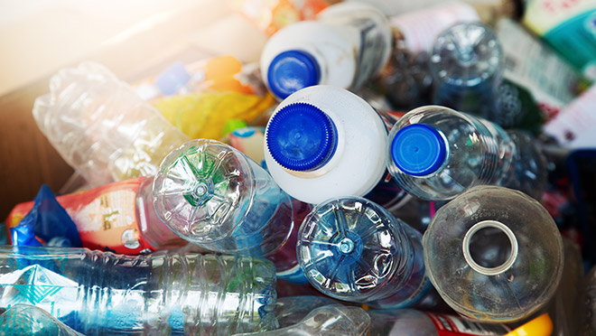Used PET bottles in a recycling bin