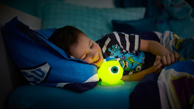 Image of boy with glowing Disney Soft Pal Image of boy with glowing Disney Soft Pal