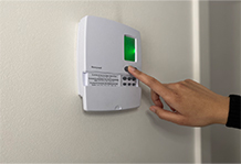 Person is adjusting the thermostat