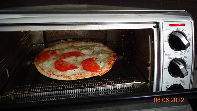 Pizza cooking in Bonnie Barr's toaster oven Pizza cooking in Bonnie Barr's toaster oven