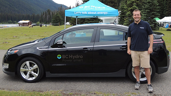 Image of BJ Mayer standing next to a BC Hydro Chevrolet Volt Image of BJ Mayer standing next to a BC Hydro Chevrolet Volt