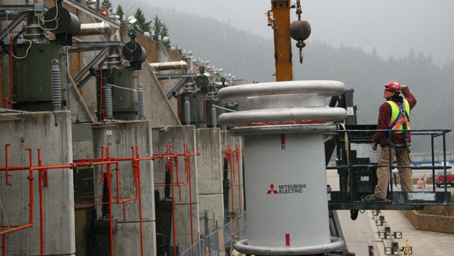 Crew installing equipment above-ground in Mica