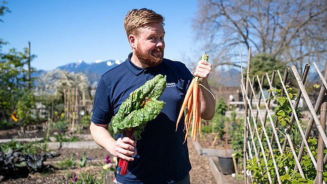 BC Hydro's Dave enjoying the bounty of a community garden