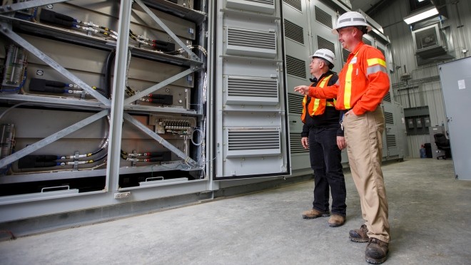 Trevor Wareham, BC Hydro Electrician Sub foreman and Vlad Kositsky, BC Hydro Project Manager inspect one of four banks of sodium-sulphur battery modules. Trevor Wareham, BC Hydro Electrician Sub foreman and Vlad Kositsky, BC Hydro Project Manager inspect one of four banks of sodium-sulphur battery modules.
