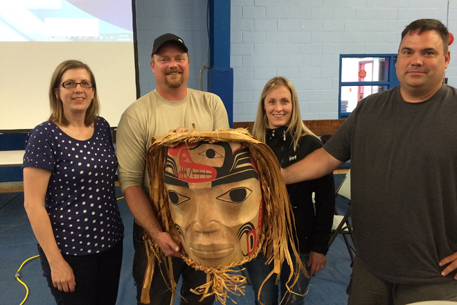 Haisla Nation mask presentation BC Hydro's Melissa Prouse, Jeff Nelson, Lia Wallace and Dan Davies pose with Haislan Mask