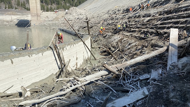 Workers at La joie Lake working on concrete structures Workers at La joie Lake working on concrete structures