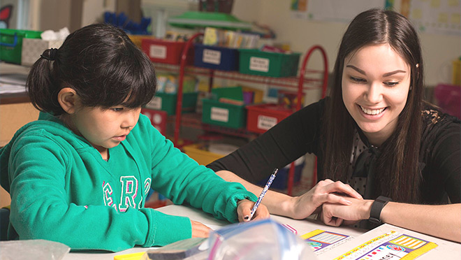 Student and teacher in a classroom