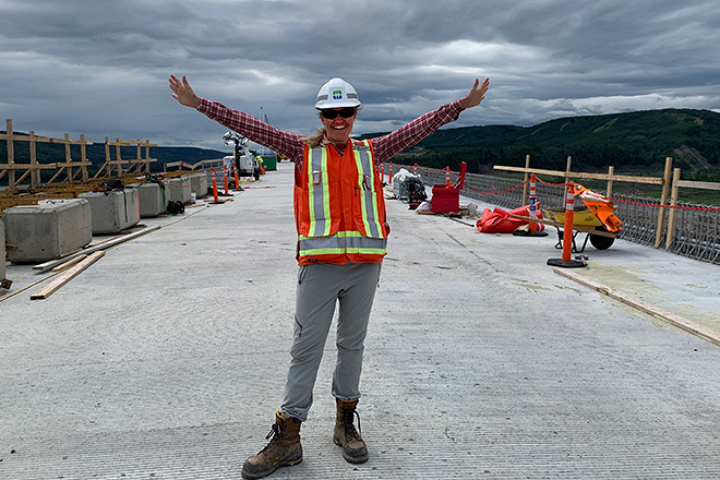 BC Hydro employee Molly Brewis stands on the Halfway River bridge