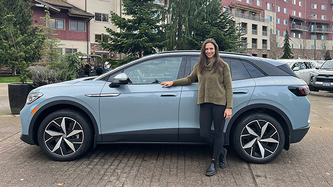 BC Hydro employee Nadia Gormley stands next to her new Volkswagen ID.4