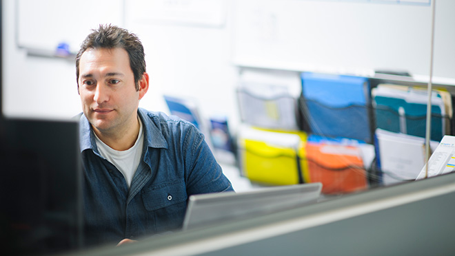 Image of office employee working at computer Image of office employee working at computer