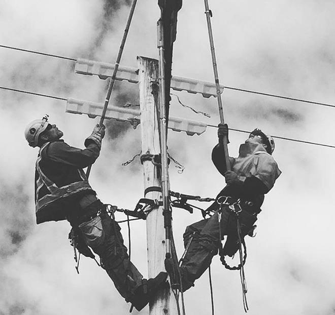 Will Van Den Born and son Josh working on fallen line Will Van Den Born and son Josh working on fallen line